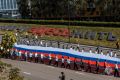 Молодёжный совет МЧС Липецкой области присоединился к шествию с огромным триколором в День Государственного флага